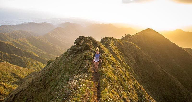girl high up on mountain trail