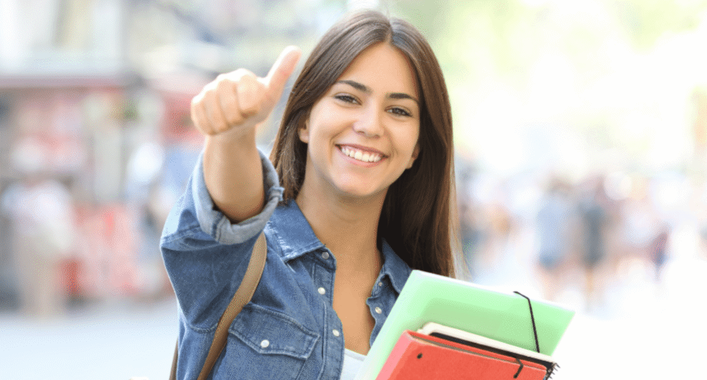 student girl giving thumbs up
