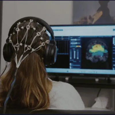 girl wearing brain map cap during, neurofeedback for adhd therapy